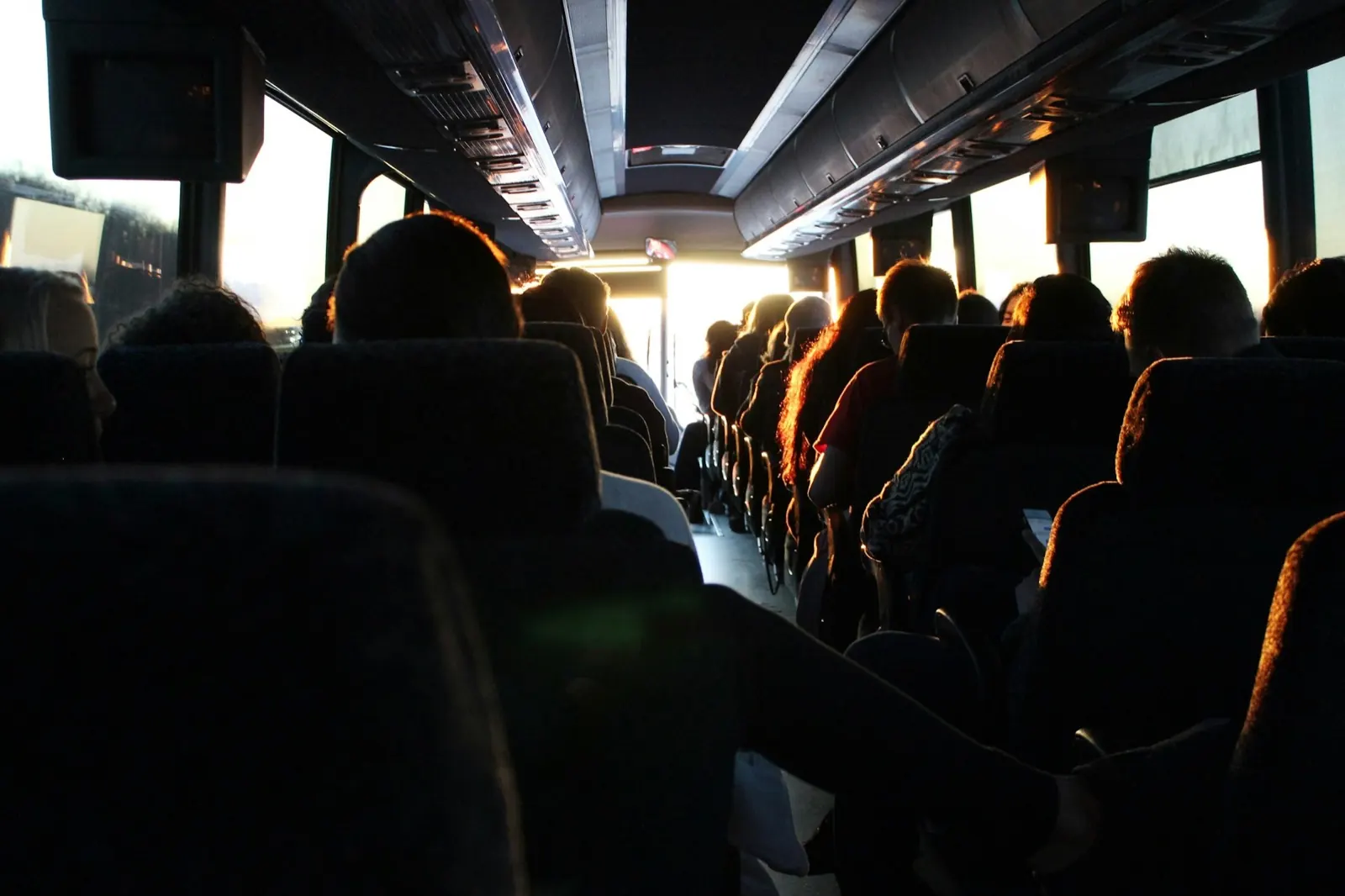 Commuters travelling in a shuttle at first light on the way to work in Cape Town