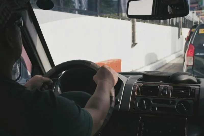 A TransportPlus driver at the wheel on an evening staff transport route in Cape Town