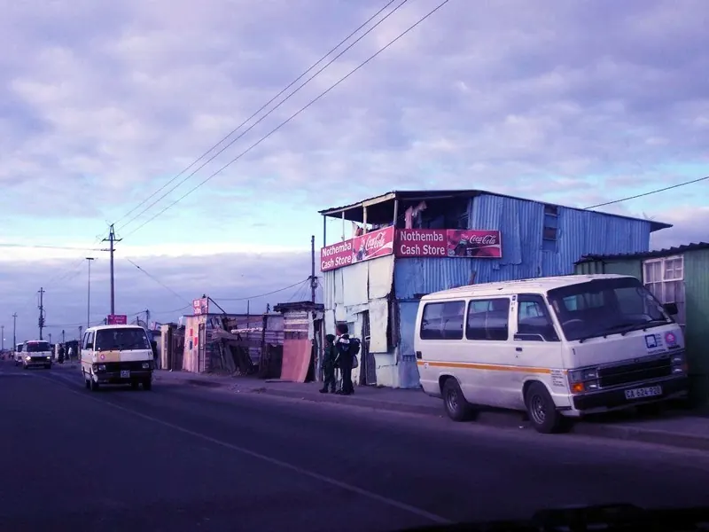 Minibus taxis on a main road in Khayelitsha, Cape Town at dawn