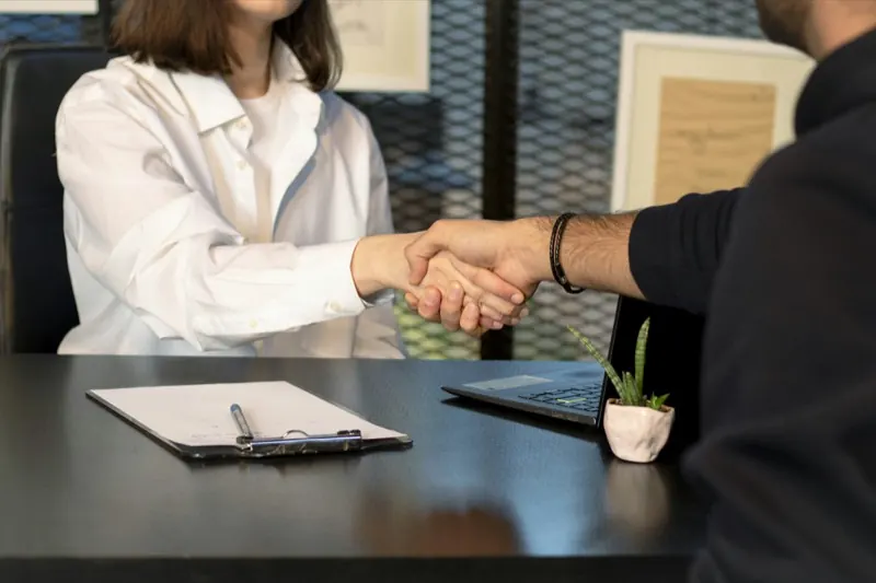 A TransportPlus account manager and a client agreeing terms for staff transport in Cape Town