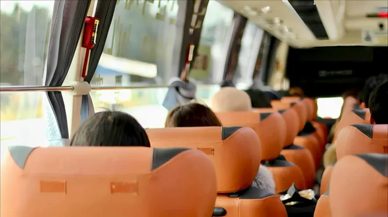 Passengers seated in a TransportPlus commuter shuttle on the way home from work